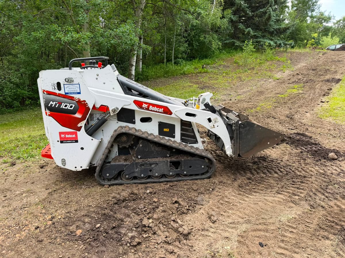 Kilt Contracting Bobcat MT100 grading an Alberta acreage